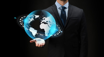 businessman with virtual earth projection