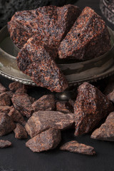 Dragon's blood is a red resin obtained from different species of plant : Croton, Dracaena, Calamus rotang. It has been in continuous use since ancient times as varnish, medicine, incense, and dye.