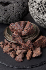 Dragon's blood is a red resin obtained from different species of plant : Croton, Dracaena, Calamus rotang. It has been in continuous use since ancient times as varnish, medicine, incense, and dye.