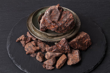 Dragon's blood is a red resin obtained from different species of plant : Croton, Dracaena, Calamus rotang. It has been in continuous use since ancient times as varnish, medicine, incense, and dye.