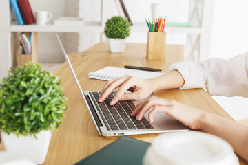 Woman typing on keyboard
