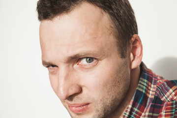 Obraz premium Young adult Caucasian man looks at camera