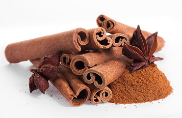 Cinnamon and anise on white background.