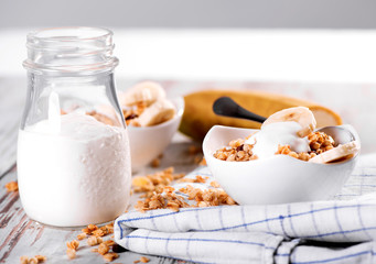 Morning breakfast musli with milk and banana
