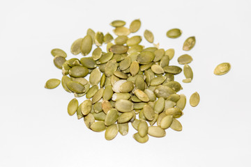 Pumpkin seeds on a white background