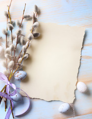 Easter background with Easter eggs and spring flowers. Top view with copy space