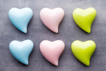 Colored heart on the gray background. View from above. Flat lay.