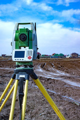 Measurement of land for construction. A theodolite.Total station