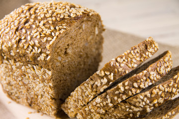 Bread with sesame seeds on a cutting board
