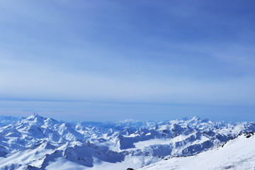 Fototapeta premium beautiful winter mountains with blue sky, snowy peaks. amazing scenic nature landscape.
