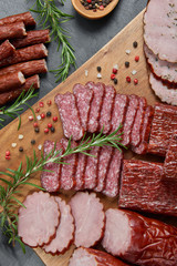 Set of cold cuts on a wooden board. Mix of sausages