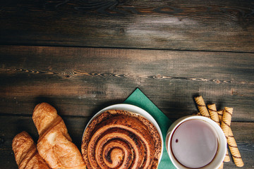 Coffee mug on the table of croissant sweets