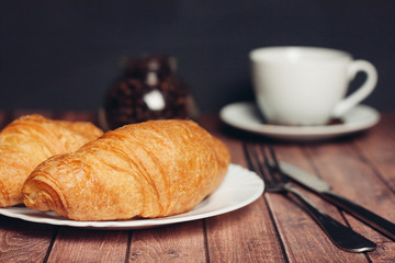 Coffee mug on the table of croissant sweets