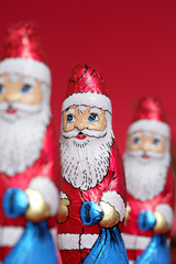 Santa Claus chocolates in a row