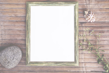 Vertical frame with white blank page faded background. Rustic wooden board backdrop with natural decor.