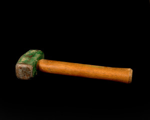 Green headed mallet on a black background