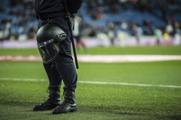 Fototapeta premium Policeman in the soccer field