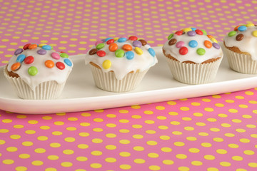 Muffins on a plate in a row