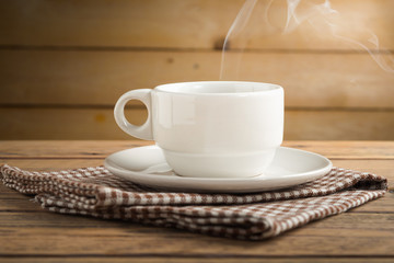 Coffee cup on wood table.