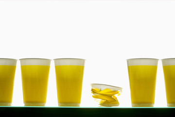 Crumpled cup between plastic cups
