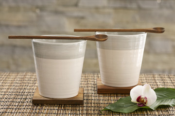 Wooden spoons on beakers
