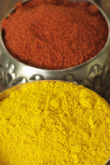 Curry and cayenne pepper in dishes
