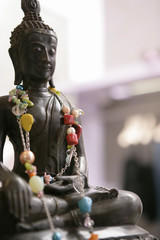 Buddha figure with necklet