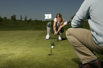 Young couple on golf course