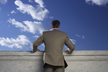 Businessman standing at balustrade