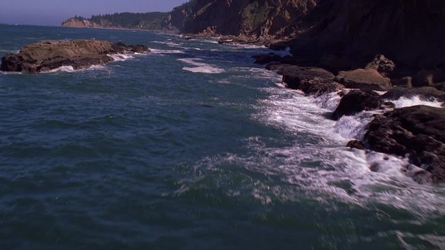 Low flight paralleling Pacific shoreline 