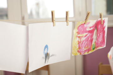Pictures hanging on a clothesline to get dry