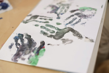 Painted hand prints on paper