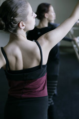 Obraz na płótnie Canvas Female ballet dancers doing exercises