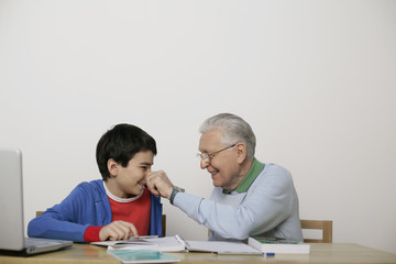 Grandfather pinching boy's nose, fully_released