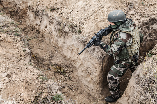 Paratrooper of french 1st Marine Infantry Parachute Regiment RPIMA in entrenchments, top view from above