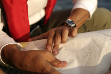 Man reading a nautical chart