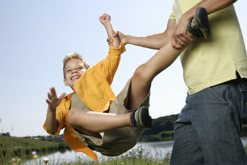 Father spinning around his son
