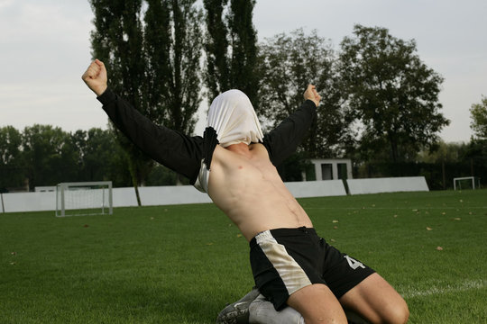 Soccer Player With Shirt Over His Head Celebrating