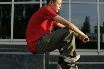 Boy sitting on a step