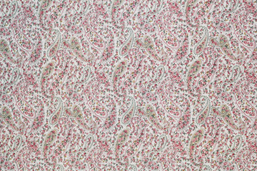 Pink cotton fabric in paisley pattern for background or texture