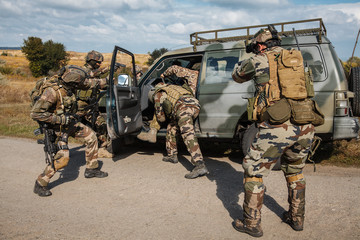 Squad of elite french paratroopers of 1st Marine Infantry Parachute Regiment RPIMA detaining...