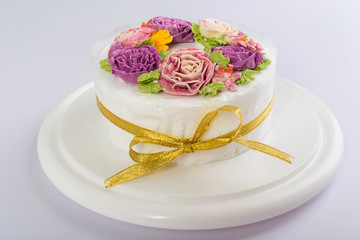 Delicious creamy cake with flowers