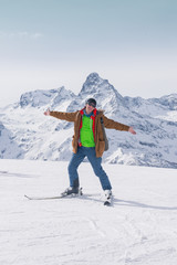 Fototapeta na wymiar Alpine skiing in the high mountains. Active positive skier.