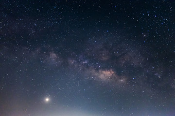 Naklejka premium Milky way galaxy with stars and space dust in the universe, Long exposure photograph. with grain