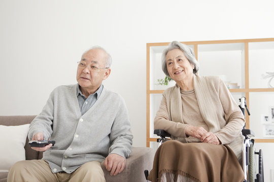 Senior couple watching tv