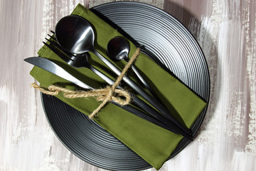 A black plate with cutlery