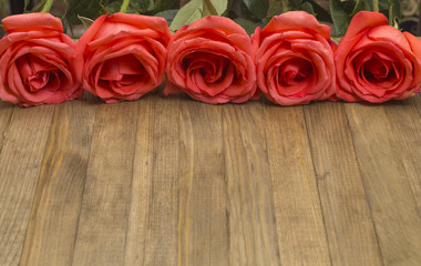 bouquet red pose flowers on wooden background