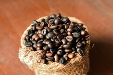 close up of coffee beans on sack