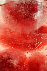 Cherry berries frozen in ice in water  2