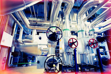 Equipment, cables and piping as found inside of a modern industrial power plant